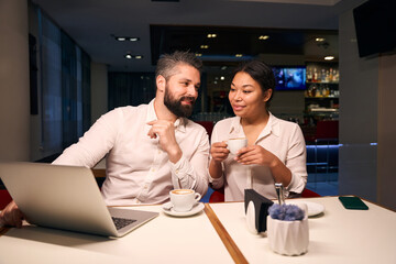 Young couple whiling away time in coffee shop