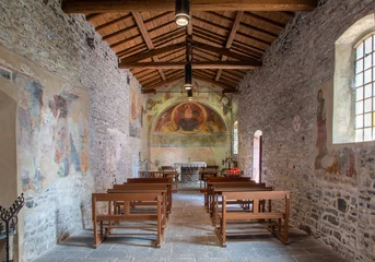 Poster VARENNA, ITALY - JULY 20, 2022: The romanesque church of St. John the Baptist with the fresco of Jesus the Pantokrator in the apse  from 16. cent. © Renáta Sedmáková