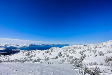 Breathtaking Lake Tahoe Panorama - Snowy Peaks and Clear Sky