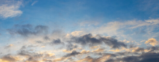 Fototapeta premium Dark clouds in the blue sky during sunset