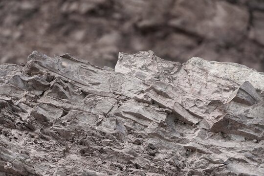 Light stone background. Rock texture detail. Mountain surface grungy texture wallpaper.  Stone surface.  Close-up of abstract natural rock.