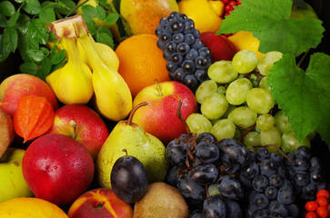 Naklejka na ściany i meble A variety of fruits on a wooden table.