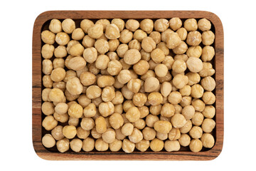 top view of roasted peeled hazelnuts in wooden plate isolated on white background, top view, healthy food concept