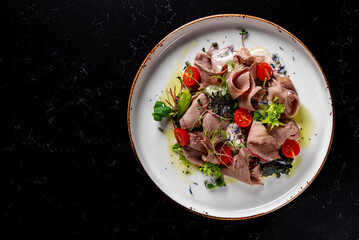 Beef tongue salad with fresh vegetables in plate