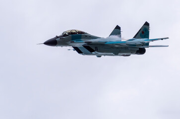 Fototapeta na wymiar Moscow Russia Zhukovsky Airfield 25 July 2021: aerobatic MiG-35 perfoming demonstration flight of the international aerospace salon MAKS-2021