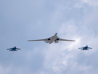 MOSCOW, RUSSIA - MAY 7, 2021: Avia parade in Moscow. su-35 and strategic bomber and missile platform Tu-160 in the sky on parade of Victory in World War II in Moscow, Russia