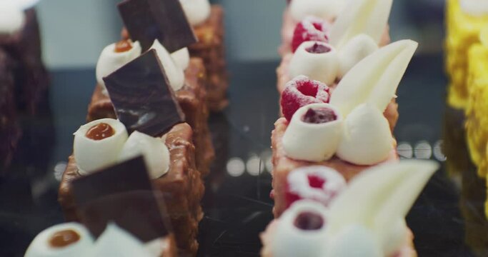 pastries of bright color on the showcase of a pastry shop.close-up.shallow depth of field.