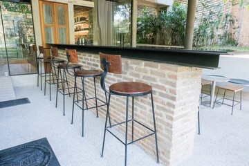 Circular metal table and chair at restaurant.