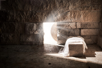Empty tomb while light shines from the outside. Jesus Christ Resurrection. Christian Easter concept.