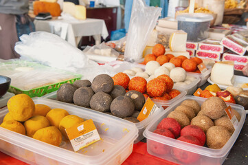 Cheeses of Russian cheese makers. Belper knoll cheese at the farm produce fair
