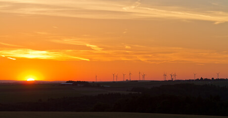 Obraz premium Wind generators at sunset, Pfalz, Germany