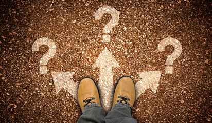 Yellow leather shoes, three arrows and question marks - problem concept
