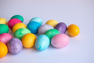 Happy Easter. Easter eggs on white background - Easter decoration, banner, panorama, background with space for text.