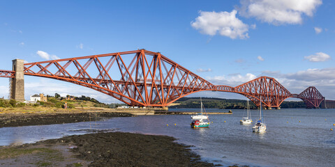 The mighty Forth rail bridge spreading across the Firth of Forth connecting north and south Queensferry. Taken from North Queensferry on A bright summer's day.