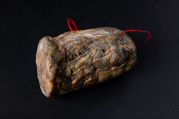 Corsican coppa isolated on a black background