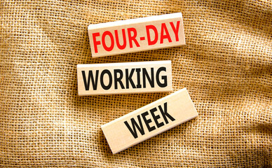 Four-day working week symbol. Concept words Four-day working week on wooden block on a beautiful canvas table canvas background. Business four-day working week concept. Copy space.