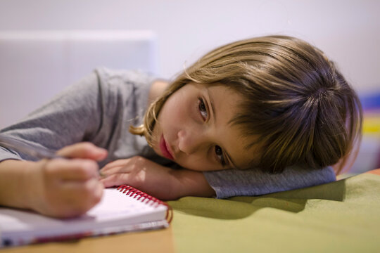 Girl bored with homework