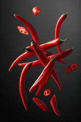 Acrylic prints Hot chili peppers Falling red chili peppers.