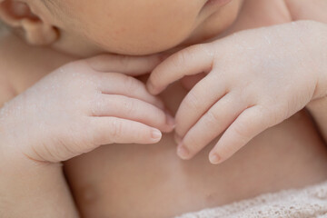 Obraz na płótnie Canvas close up of baby hands and fingernails