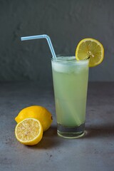Healthy Lemon Juice limo pani fresh juice served in glass with lemon slice and straw side view on...