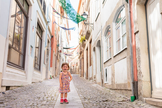Happy Little girl portrait in the street