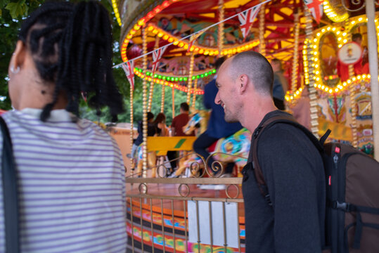 Candid street travel moment at the amusement park