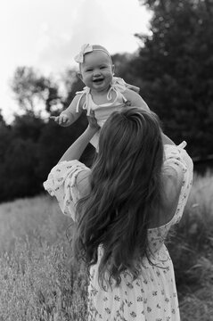 mom and daughter playing outdoor