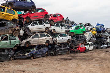 Fototapeta na wymiar Wrecked car junkyard, cars for scrap