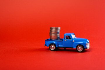 Toy car truck with coins.  Car carrying coins 