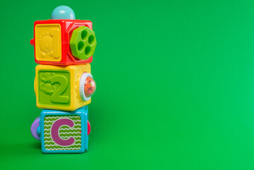 baby toys cube on green background