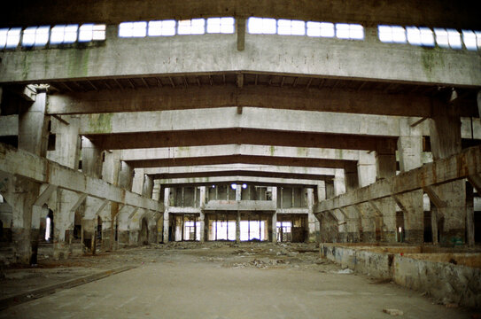 Inside abandoned industrial area with grey cement geometric colours 