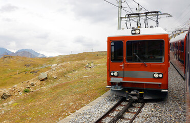 Fototapeta premium The mountain train from Zermatt up to Gornergrat. The Gornergrat bahn. Summer in the swiss alps. Switzerland.
