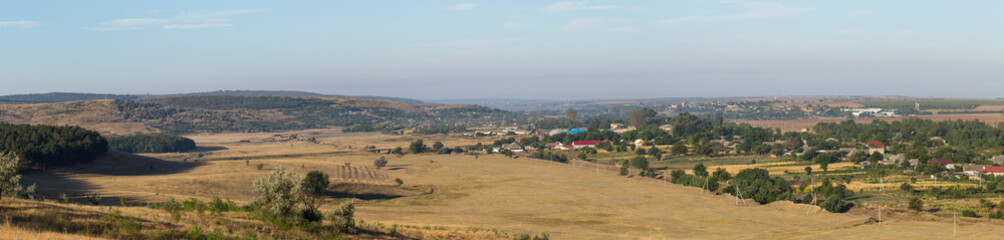 Landscapes of the Northern regions of Moldova. A pastoral panorama with nature. Moldovan villages and houses and streets.