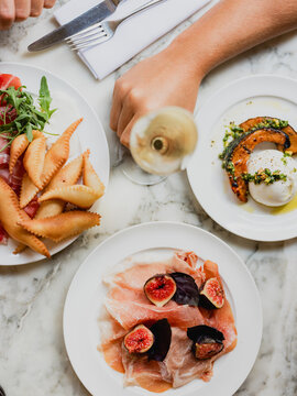 Burrata with roasted pumpkin and prosciutto with figs and parmesan