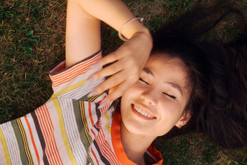 Woman Laying Down On Grass
