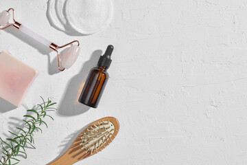 Skin care concept with face roller on rustic white table