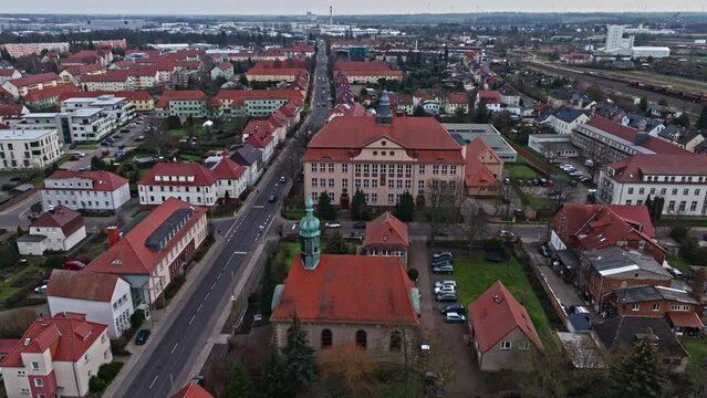 Drone shot revealing Saint Liborius church and "Marie Gerike" Secondary school ("Marie Gerike" Sekundarschule) , Haldensleben , Germany .