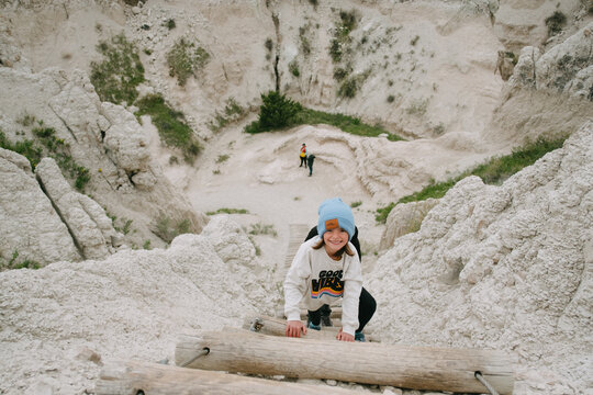 Kids climb staircase on Notch Trail hike in The Badlands National park