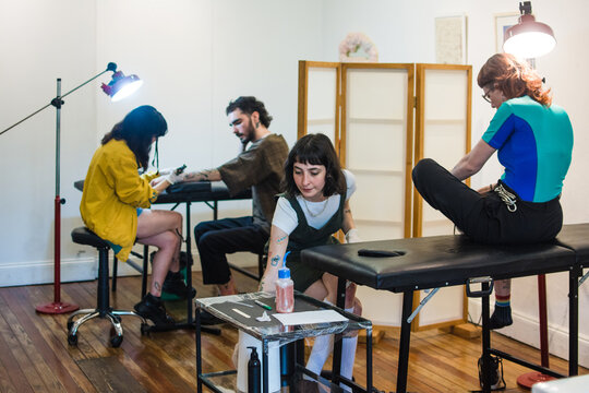 Tattoo parlor with clients