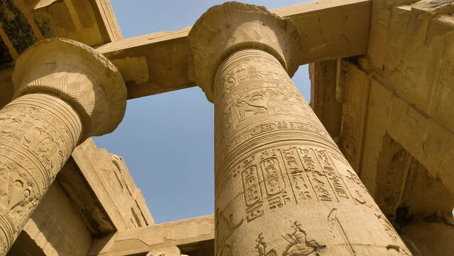 2022 - Low angle view of columns with hieroglyphs at Egypt's Temple of Kom Ombo.
