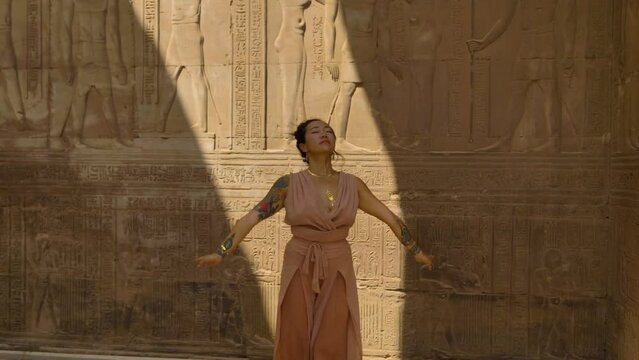 2022 - A modern dancer performs inside Egypt's Temple of Kom Ombo.