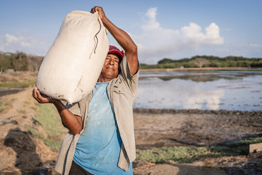Man working in a salt flat. 