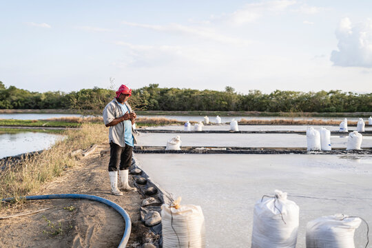 Outdoor salt field worker. 