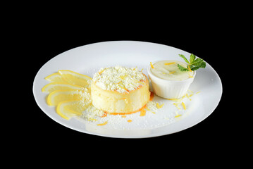 Delicious condensed milk and coconut pudding on a white plate - Coconut pudding with eggs sprinkled with powdered milk
