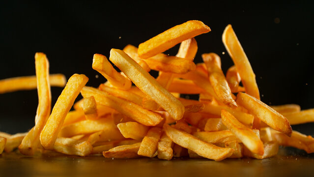 Freeze Motion Shot of Falling Fresh French Fries, Close-up