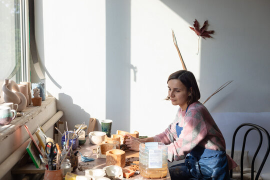 conceived potter at the table