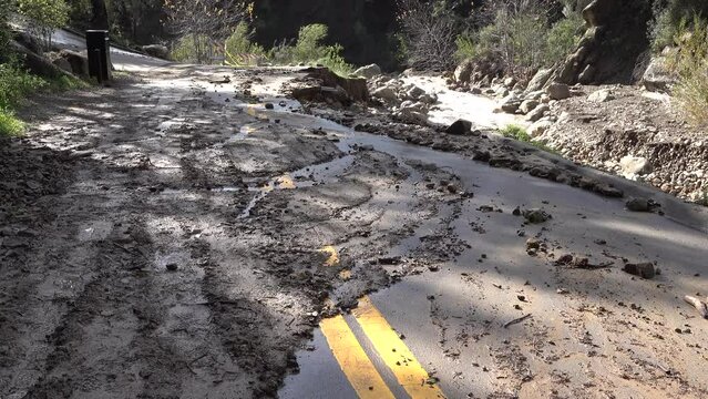 2023 - Mud obscures much of a partially demolished road in the aftermath of flooding in Santa Barbara, California.
