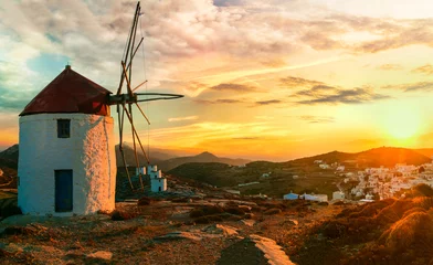 Foto op Canvas Traditional typical  greek windmills. Amorgos island in Cyclades, view of Chora village over sunset © Freesurf