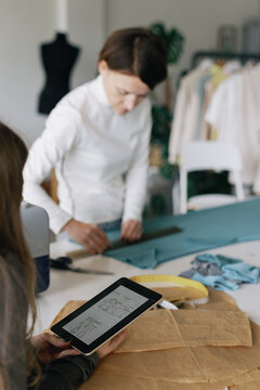 Fashion industry. Modiste team. Atelier. Sewing scheme. Pattern