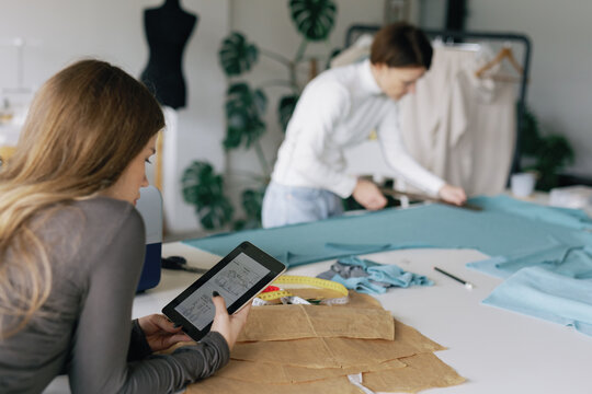 Couturier worktable. Fashion studio. Fabric. Garment manufacture